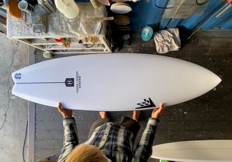 getting ready to repair a surfboard damaged