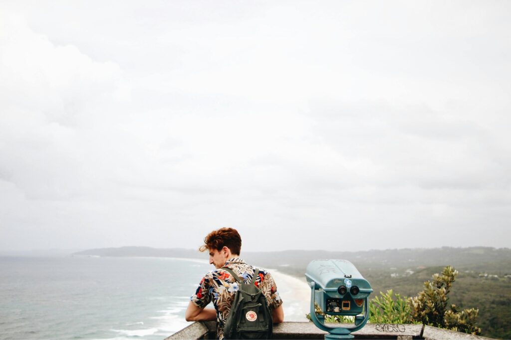 a guy looking at the beach