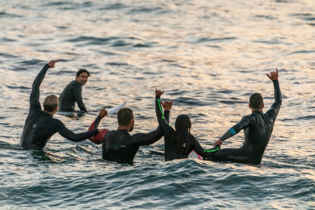 a groupe of surfer wearing wetsuites