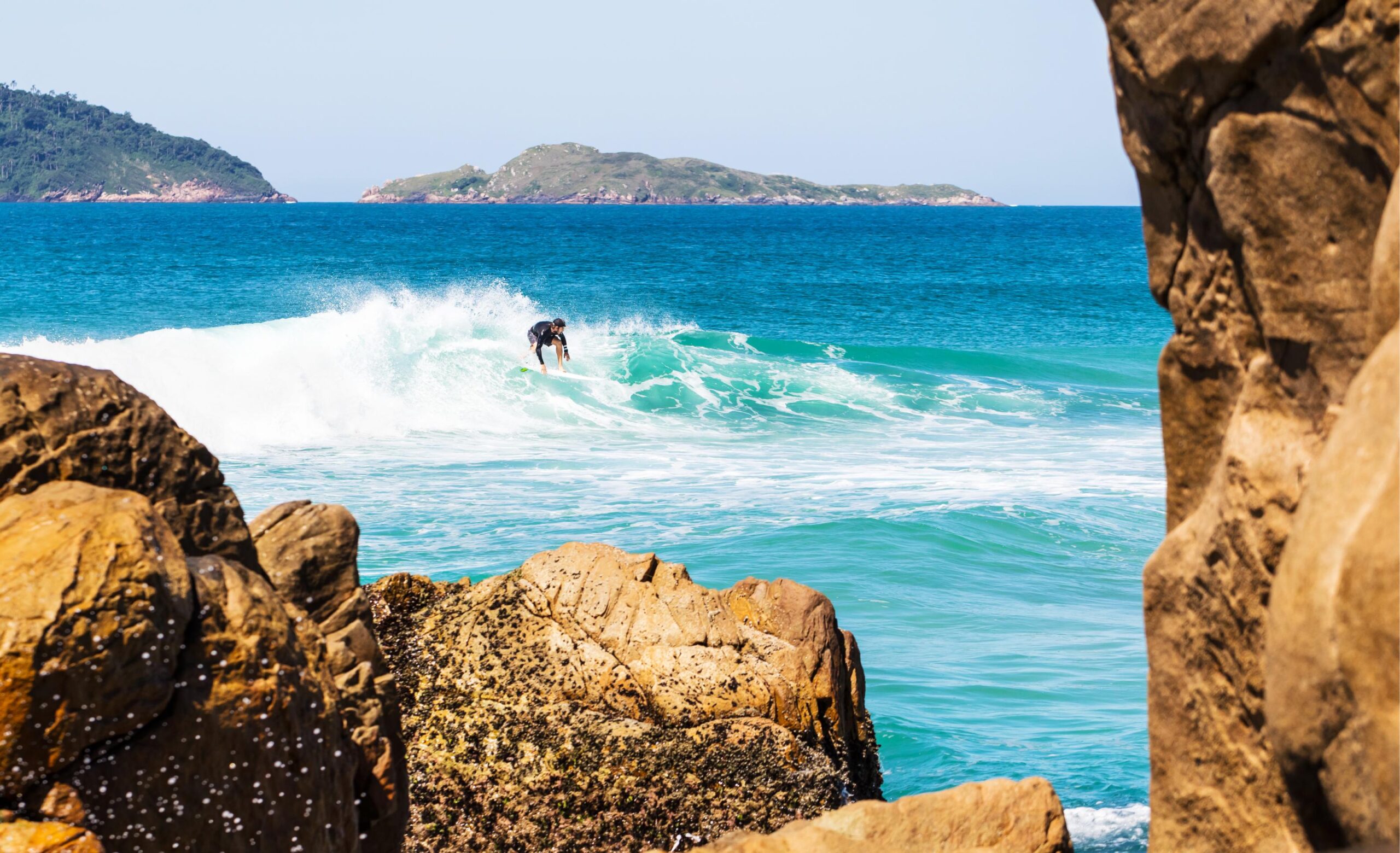 a person surfing on an amazing surf spot