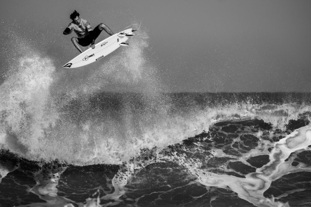 a surfer surfing high waves in action