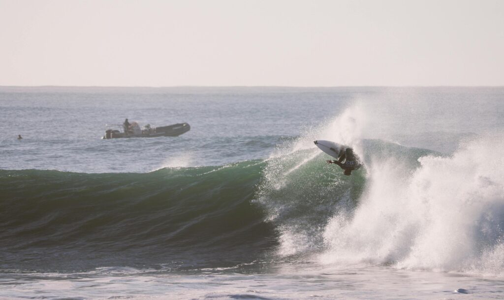 a surfer surfing on a large wave