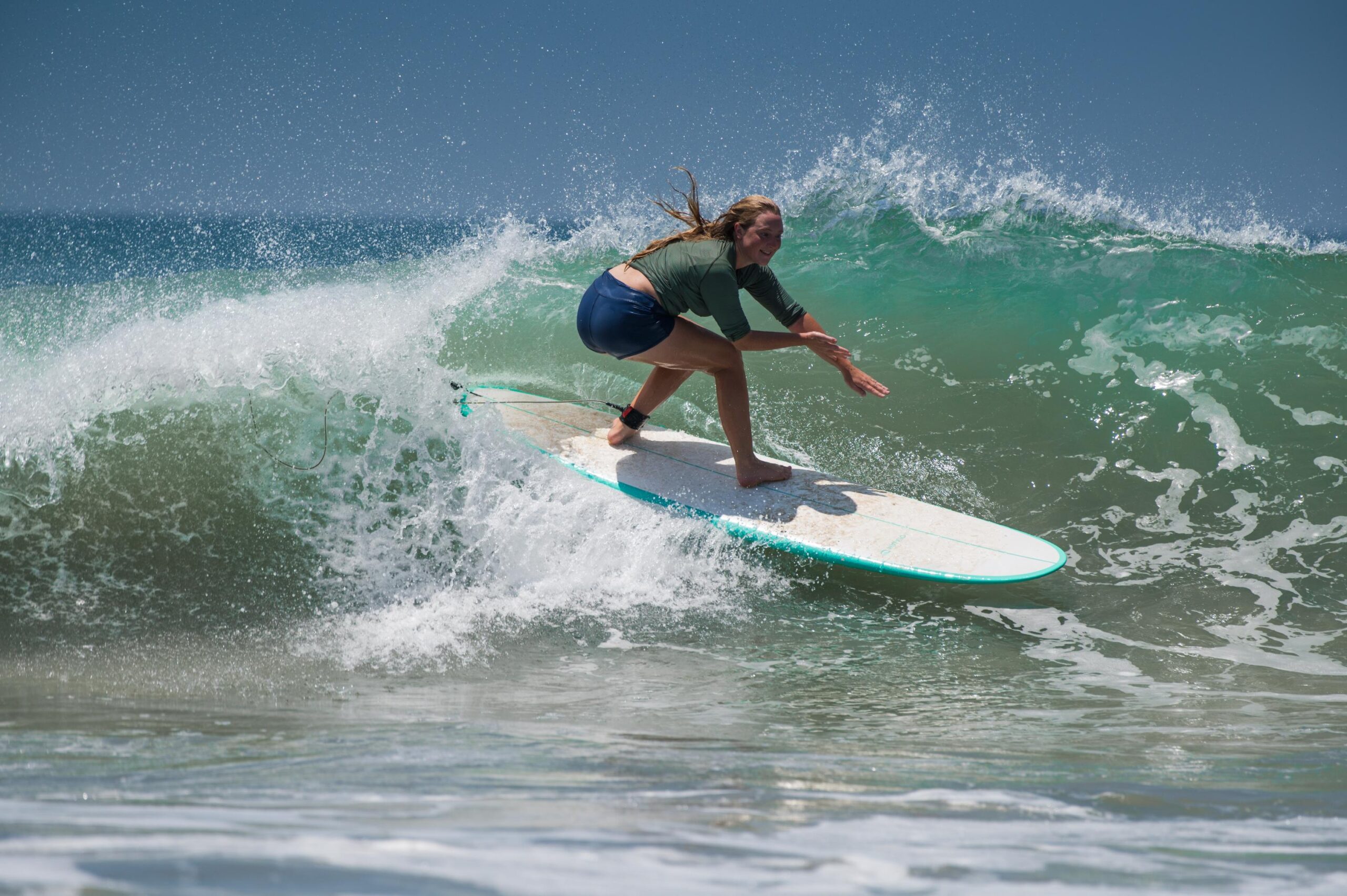 a beginner surfer on his board