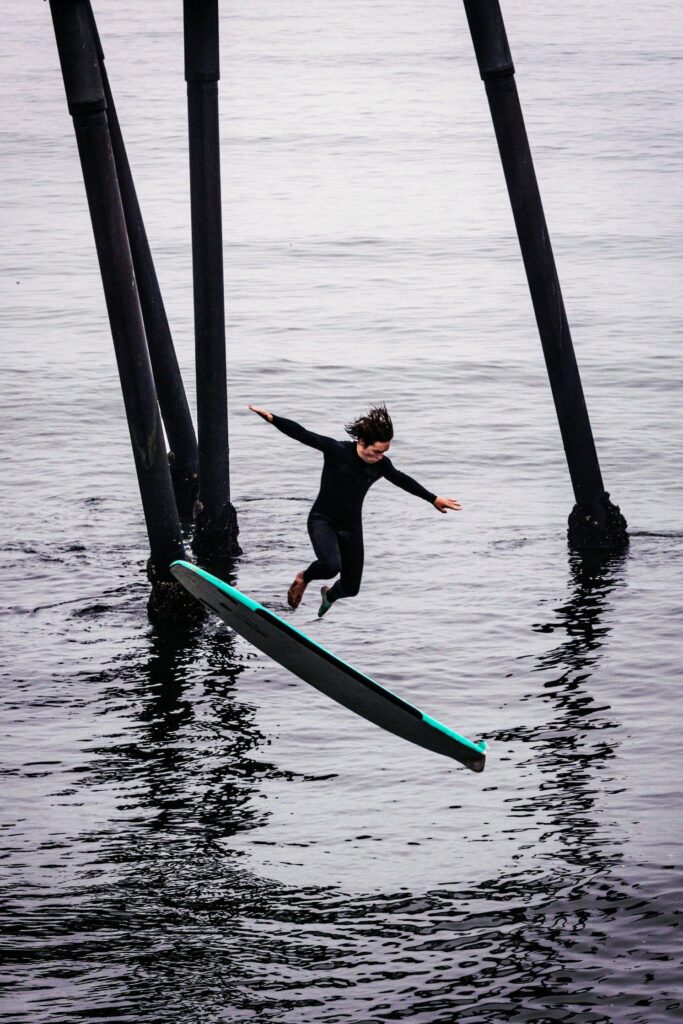 a guy falling which shows How Long Does It Take to Learn How to Surf?