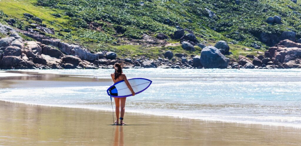 a surfer checking the conditions of the ocean