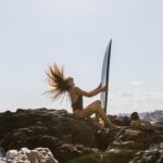 a women feeling happy and clear minded ready to surf