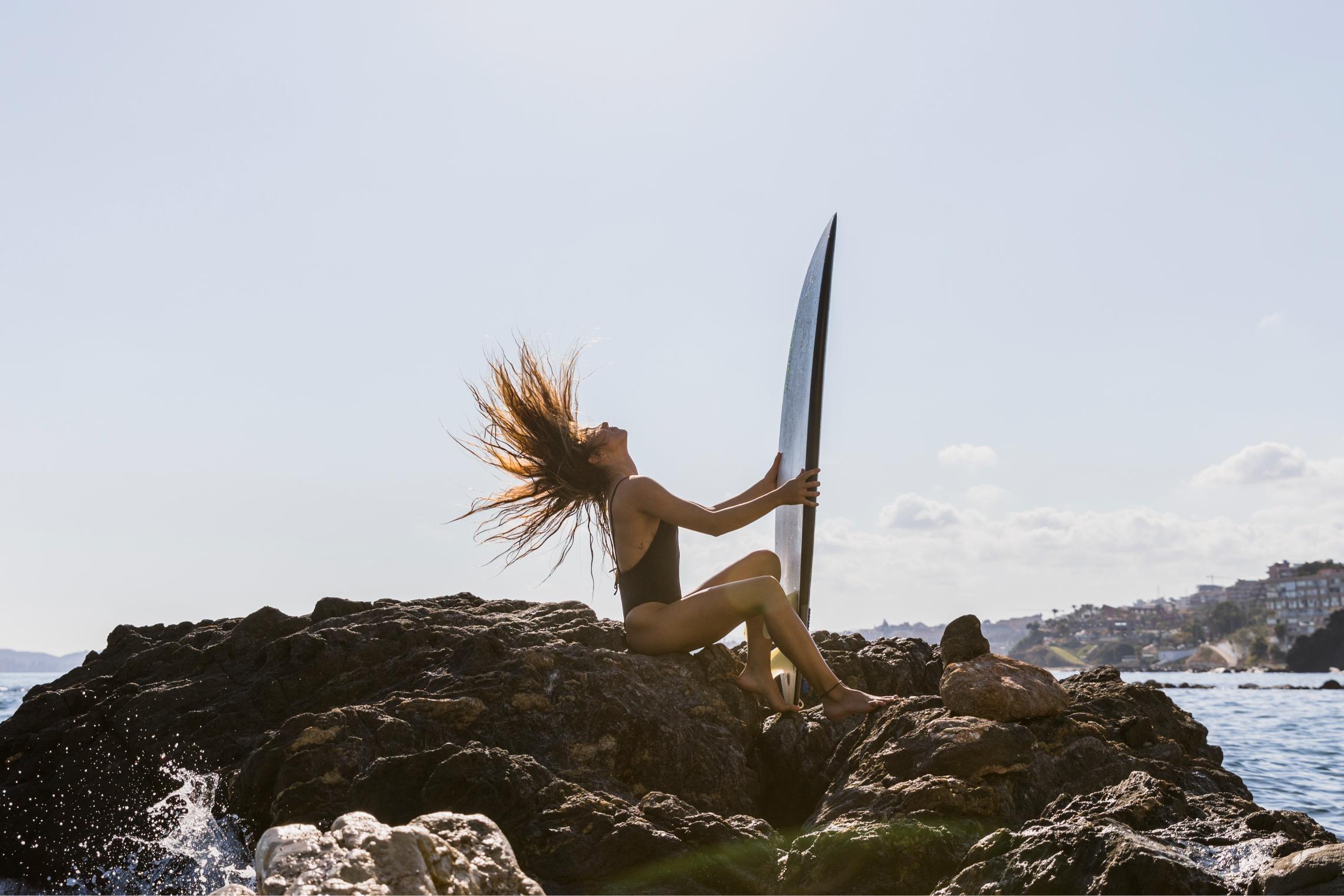 a women feeling happy and clear minded ready to surf